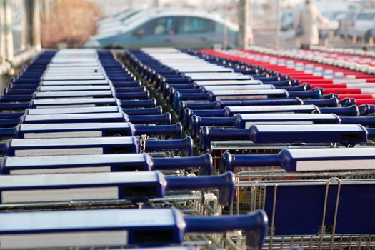 Row of empty shopping carts at the supermarket
