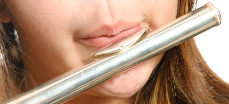 Closeup view of the way you are supposed to blow on the mouth piece of a flute for it to make noise.