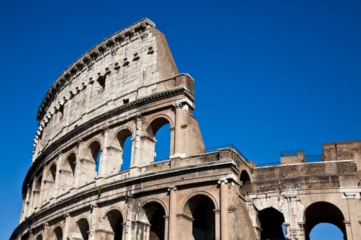 Colosseum in Rome with blue sky, landmark of the city