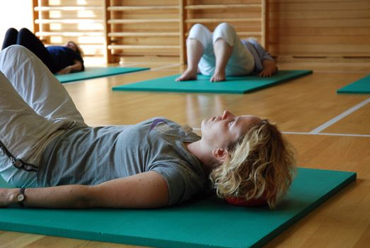 SAALFELDEN, AUSTRIA - AUGUST 30: physical therapist exercising with rheumatism patient group on August 30, 2007 at rehabilitation center in Saalfelden, Austria.