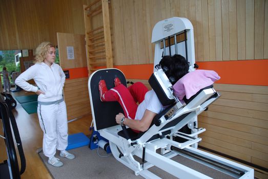 SAALFELDEN, AUSTRIA - AUGUST 30: physical therapist assisting female patient on August 30, 2007 at rehabilitation center in Saalfelden, Austria.