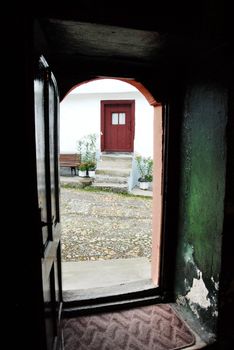 view from opened door of old orthodox church in Serbia, Saint Roman Monastery