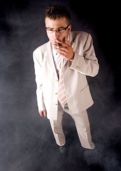 Businessman smoking cigar