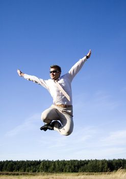 Businessman jumping for joy