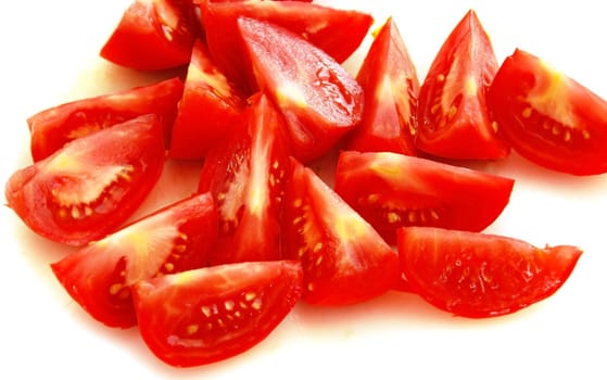 red ripe tomato slices over white background