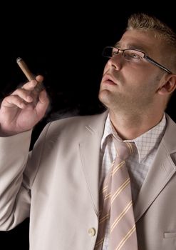 Businessman smoking cigar