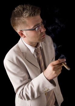 Businessman smoking cigar