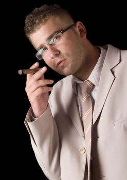 Businessman smoking cigar