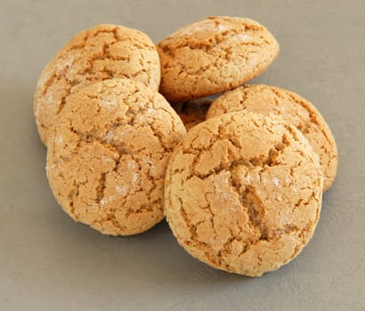 heap of fresh appetizing oatmeal cookies over gray background