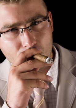 Businessman smoking cigar