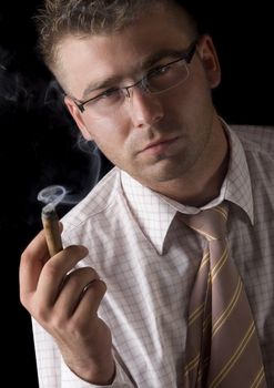 Businessman smoking cigar