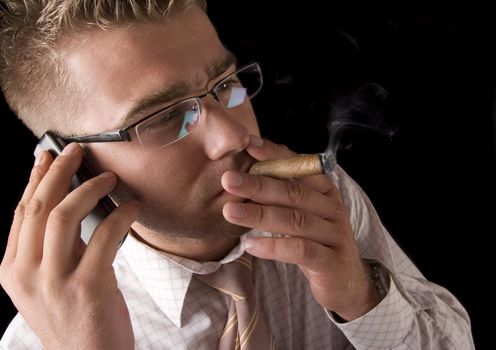 Businessman smoking cigar