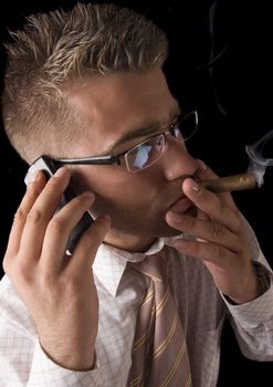 Businessman smoking cigar