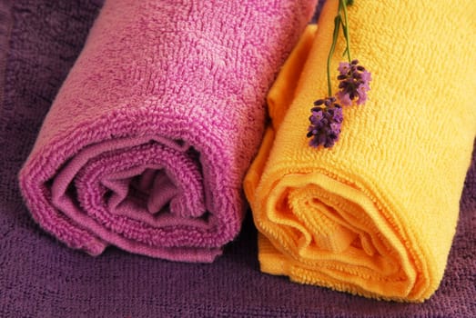 magenta, purple and yellow towels with lavender flowers