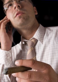 Businessman smoking cigar