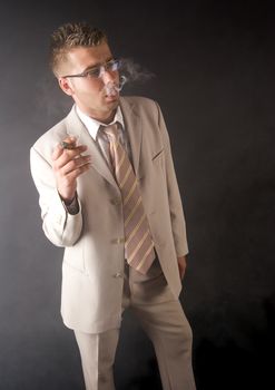 Businessman smoking cigar