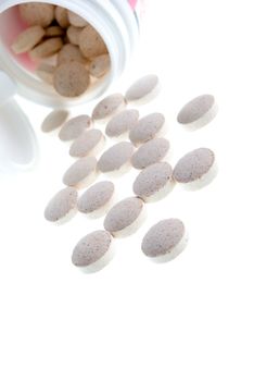 Tablets  ,Pills Spilling out of Pill Bottle closeup