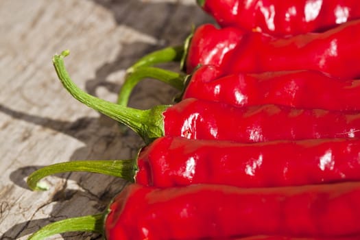 red peppers on an old wooden table