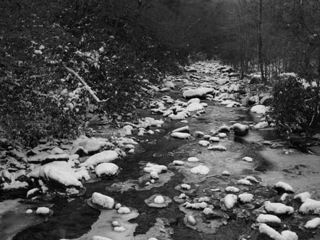 View along the Jacobs Fork River at South Mountain State Park after a snow fall