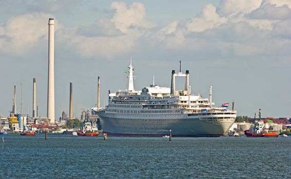 VLAARDINGEN -THE NETHERLANDS-AUGUST 2008-Pulled by tugs, retired HAL�s SS Rotterdam passes by on her last voyage to her homeport Rotterdam. August 04, 2008, Hoek van Holland, The Netherlands