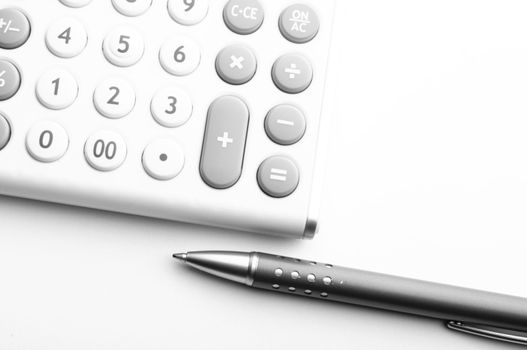 financial accounting concept with white calculator in office