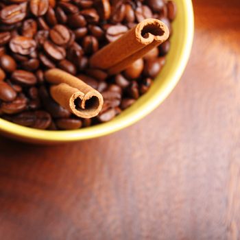 coffee beans and cinnamon with copyspace showing food concept