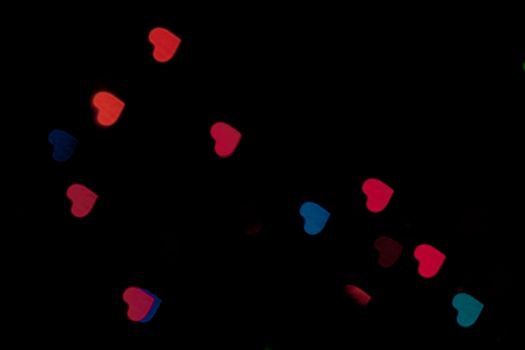 An abstract picture of some bokeh heart lights.