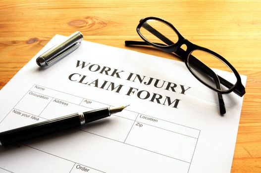 work injury claim form showing business insurance concept