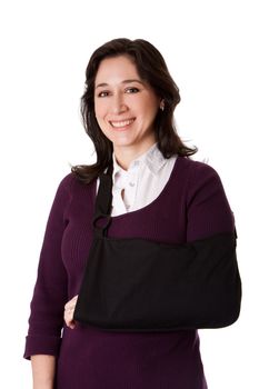 Happy attractive woman with broken arm in sling, isolated.