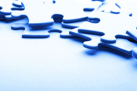 puzzle or jigsaw on whote blank paper with copyspace