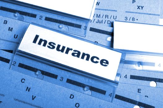 insurance word on business folder showing risk management concept