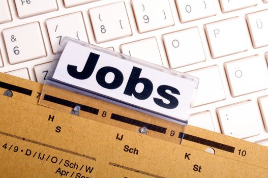 jobs or job concept with business folder in office showing earnings concept