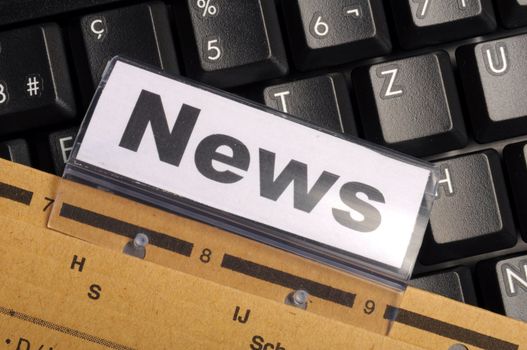 news or newsletter concept with word on folder register in business office
