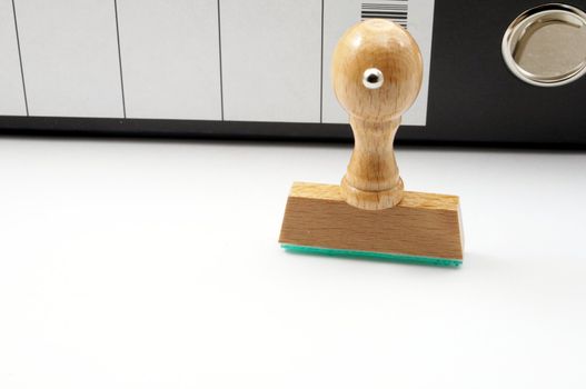 stamp in office with documents showing bureaucracy concept
