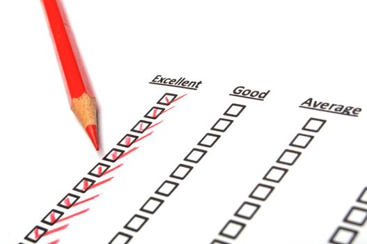 checkbox and red pen showing customer service survey or satisfaction concept to improve sales