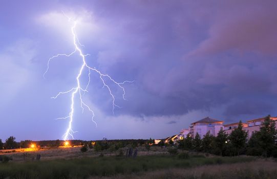 thunderstorm with lightnings and cloudy sky at rainy night