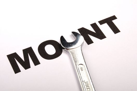 mount or mounting concept with tool and word
