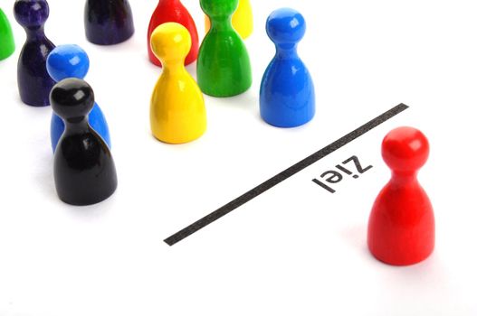 success or goal concept with pawns on white