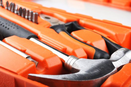 toolbox kit with hammer and screwdriver showing construction concept