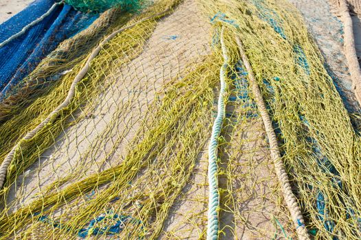 Trawl fishing nets drying on a pier