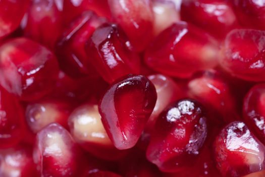 A background with a heap of pomegranate seeds