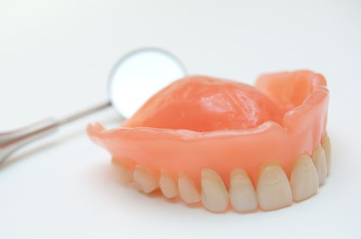Dentures with a mirror in the background