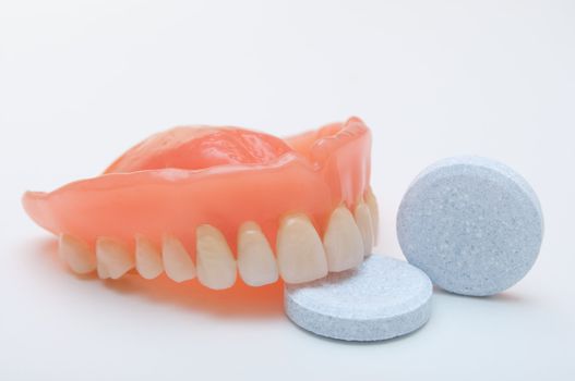 Close-up of denture with cleaning tablet