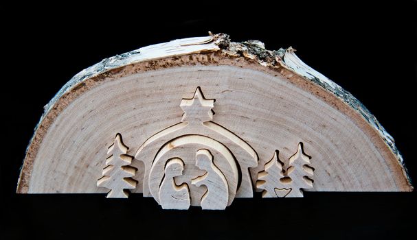 Christmas Nativity scene cut out of birch tree slice
