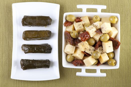Cheese, sun dried tomatoes, olives and stuffed grape leaves.