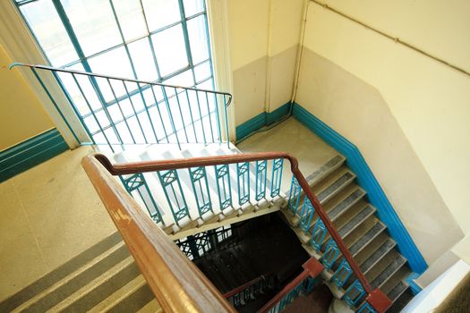 Old stair indoor with sun light thought window