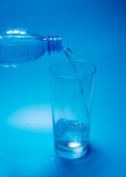 Pouring water into a glass