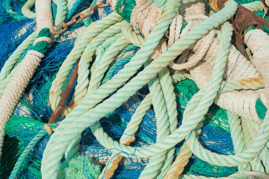 A stack of colourful fishing nets and ropes