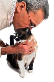 a man kissing his siamese cat in front of a white background