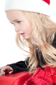 Beautiful baby girl dressed up for Christmas isolated in white